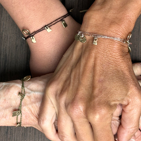 bracelets: yellow bronze with crocheted cord