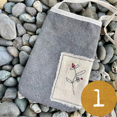 plant-dyed pocket purse with embroidered botanical patch