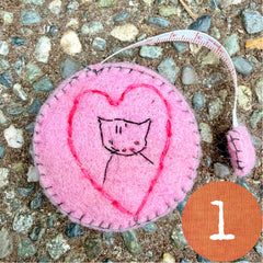 plant-dyed cat tape measures