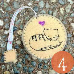 plant-dyed cat tape measures