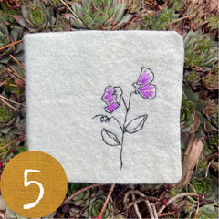 chubby little plant-dyed felt journal with botanical stitching