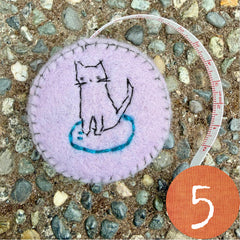 plant-dyed cat tape measures