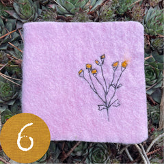 chubby little plant-dyed felt journal with botanical stitching