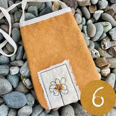 plant-dyed pocket purse with embroidered botanical patch
