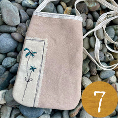 plant-dyed pocket purse with embroidered botanical patch