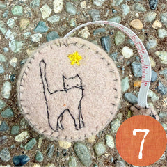 plant-dyed cat tape measures
