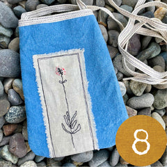 plant-dyed pocket purse with embroidered botanical patch