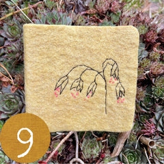 chubby little plant-dyed felt journal with botanical stitching