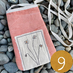 plant-dyed pocket purse with embroidered botanical patch