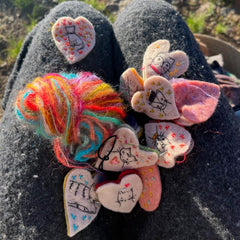 heavily stitched cat hearts in honor of jeff