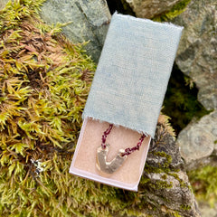 arch necklace in a plant-dyed matchbox