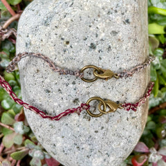 arch necklace in a plant-dyed matchbox