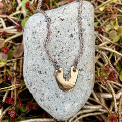 arch necklace in a plant-dyed matchbox