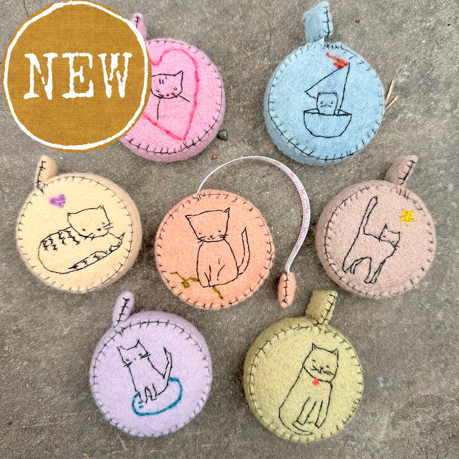 plant-dyed cat tape measures