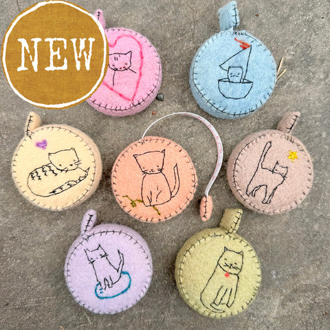 plant-dyed cat tape measures
