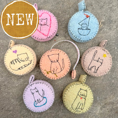 plant-dyed cat tape measures