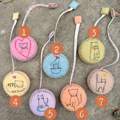 plant-dyed cat tape measures