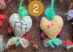 heavily stitched cat hearts in honor of jeff