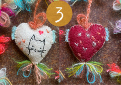 heavily stitched cat hearts in honor of jeff