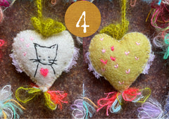 heavily stitched cat hearts in honor of jeff