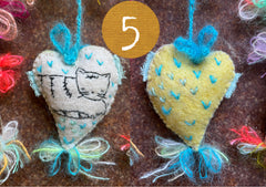 heavily stitched cat hearts in honor of jeff