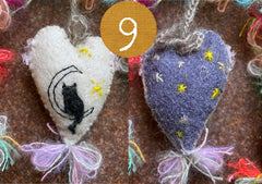 heavily stitched cat hearts in honor of jeff