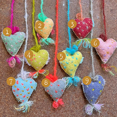 heavily stitched cat hearts in honor of jeff