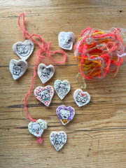 new batch! heavily stitched dog & cat wool felt hearts (fundraiser for pasadena humane)
