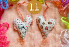 heavily stitched wool felt hearts