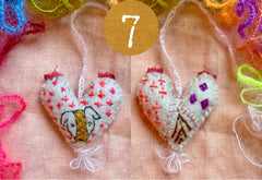 heavily stitched wool felt hearts