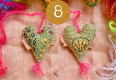 heavily stitched wool felt hearts