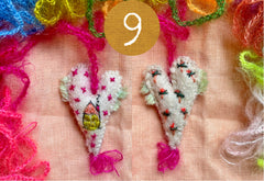 heavily stitched wool felt hearts