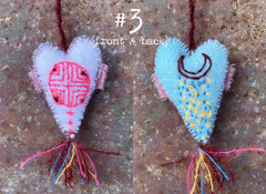 heavily stitched wool felt hearts