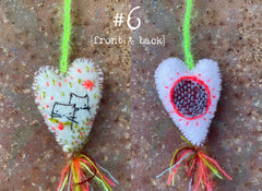 heavily stitched wool felt hearts