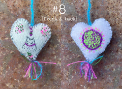 heavily stitched wool felt hearts