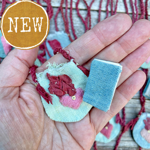 indigo heart amulet pouch with a teeny tiny book