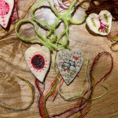 heavily stitched wool felt hearts