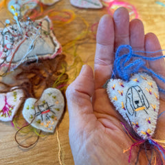 heavily stitched wool felt hearts