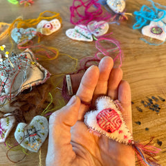 heavily stitched wool felt hearts