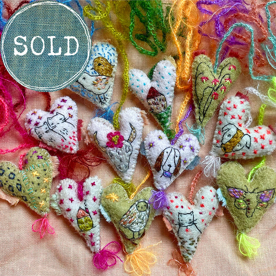 heavily stitched wool felt hearts