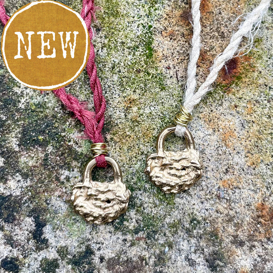 lock necklace on silk cordage in a little plant-dyed felt pocket