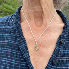 lock necklace on silk cordage in a little plant-dyed felt pocket