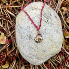 lock necklace on silk cordage in a little plant-dyed felt pocket