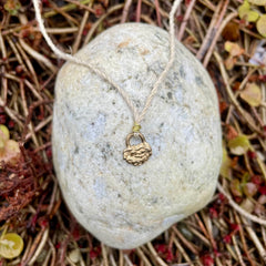 lock necklace on silk cordage in a little plant-dyed felt pocket