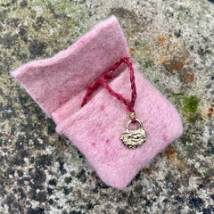 lock necklace on silk cordage in a little plant-dyed felt pocket