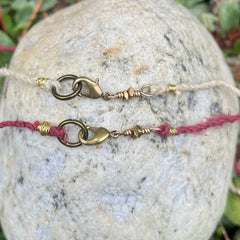 lock necklace on silk cordage in a little plant-dyed felt pocket