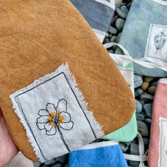 plant-dyed pocket purse with embroidered botanical patch