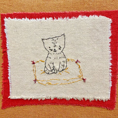 photo album: cat on a rug (ochre)