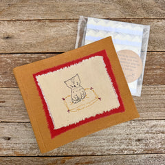 photo album: cat on a rug (ochre)