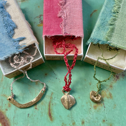 choker necklace in a plant-dyed matchbox: basin, leaf & pebble